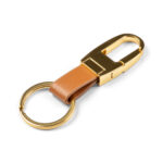 Elegantne PU-nahast võtmehoidja VH006 Gold / Orange Brown valgel taustal